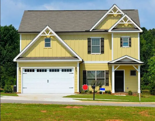 white double garage door with windows opens from center