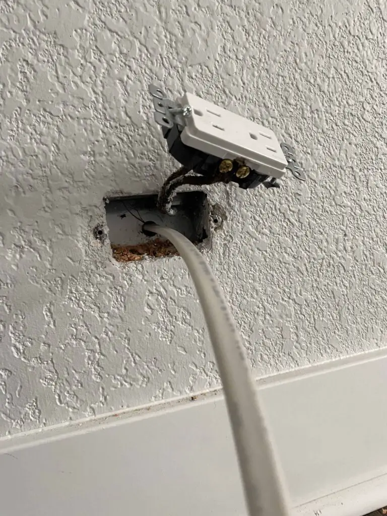 Ideally this would be outside the home but often times you may need to drill through the wall and connect to an indoor outlet.